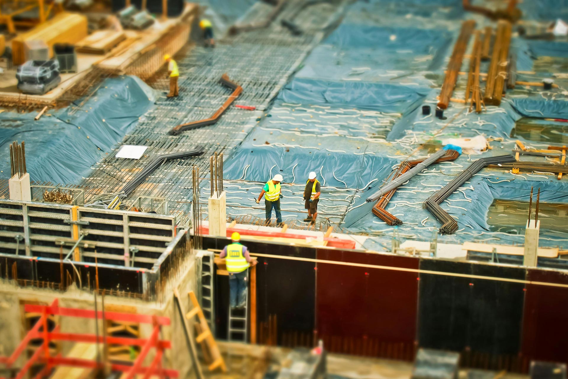 a tilt shift image of a CM Combs Construction crew at a construction site in New Orleans louisiana